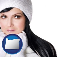 oregon map icon and a woman wearing warm, white outerwear