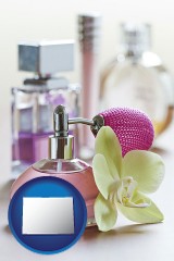 colorado map icon and a perfume bottle, with atomizer, and an orchid flower