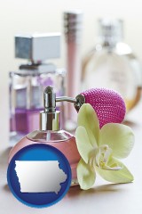 iowa map icon and a perfume bottle, with atomizer, and an orchid flower