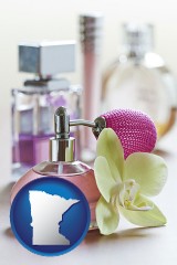 minnesota map icon and a perfume bottle, with atomizer, and an orchid flower