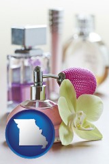missouri map icon and a perfume bottle, with atomizer, and an orchid flower