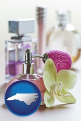 north-carolina map icon and a perfume bottle, with atomizer, and an orchid flower