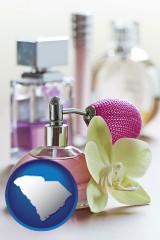 south-carolina map icon and a perfume bottle, with atomizer, and an orchid flower