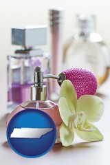 tennessee map icon and a perfume bottle, with atomizer, and an orchid flower