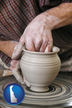 a potter making pottery on a pottery wheel - with Delaware icon