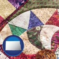north-dakota map icon and a patchwork quilt