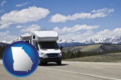 georgia map icon and recreational vehicle and snow-capped mountains