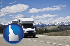 idaho map icon and recreational vehicle and snow-capped mountains