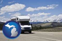michigan map icon and recreational vehicle and snow-capped mountains