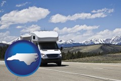north-carolina map icon and recreational vehicle and snow-capped mountains