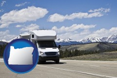 oregon map icon and recreational vehicle and snow-capped mountains