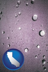california map icon and water droplets on a shower door