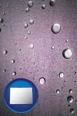 colorado map icon and water droplets on a shower door