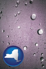 new-york map icon and water droplets on a shower door