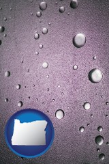 oregon map icon and water droplets on a shower door