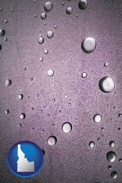 water droplets on a shower door - with Idaho icon