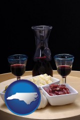 north-carolina map icon and tapas and red wine