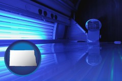 north-dakota map icon and a tanning salon solarium