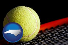 north-carolina map icon and a yellow tennis ball and tennis racket