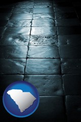south-carolina map icon and an old tile floor