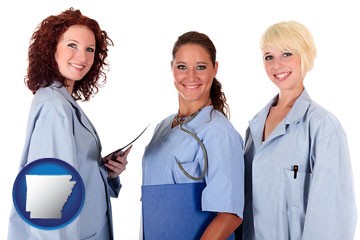 three female doctors wearing hospital uniforms - with Arkansas icon