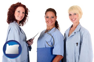 three female doctors wearing hospital uniforms - with Oregon icon