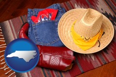 north-carolina map icon and western boots, hat, and jeans