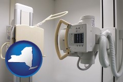new-york map icon and a hospital x-ray machine