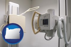 oregon map icon and a hospital x-ray machine